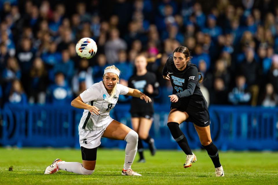 Michigan State defender Raegan Cox (8) and Brigham Young University midfielder Bella Folino (22) eye the ball during the Sweet 16 round of the NCAA College Women’s Soccer Tournament at South Field in Provo on Saturday, Nov. 18, 2023. | Megan Nielsen, Deseret News