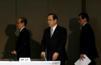 Toshiba Corp incoming President and chief executive Satoshi Tsunakawa (L), incoming chairman Shigenori Shiga (R) and outgoing President and CEO Masashi Muromachi arrive at a news conference at the company headquarters in Tokyo, Japan May 6, 2016. REUTERS/Issei Kato