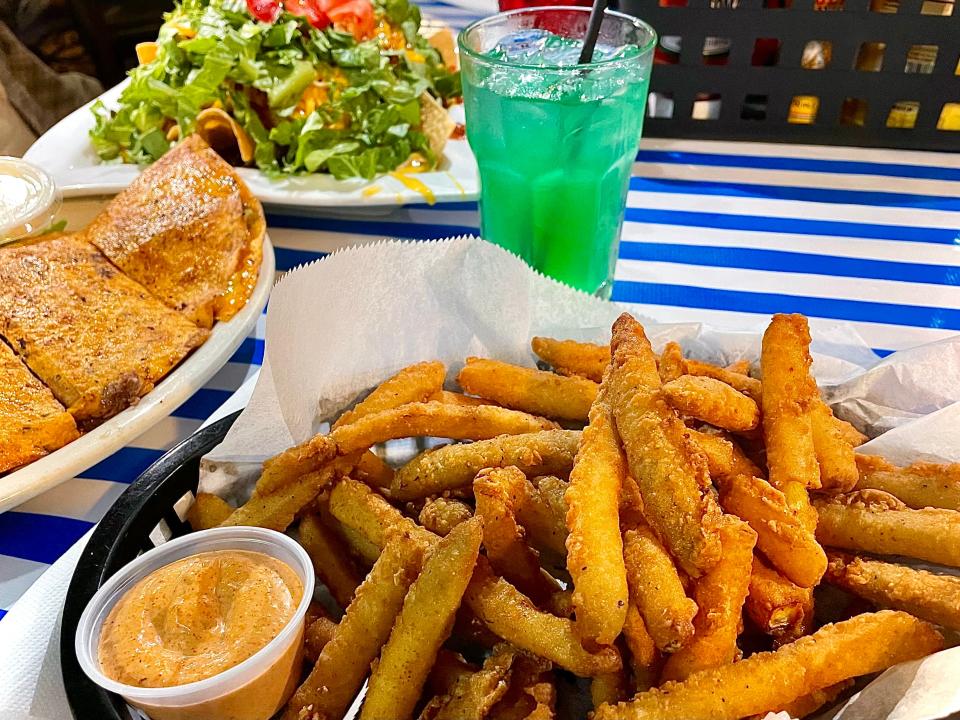 Pickle fries and Liquid Marijuana cocktail from Lagerheads Bar and Grill in Ormond by the Sea.