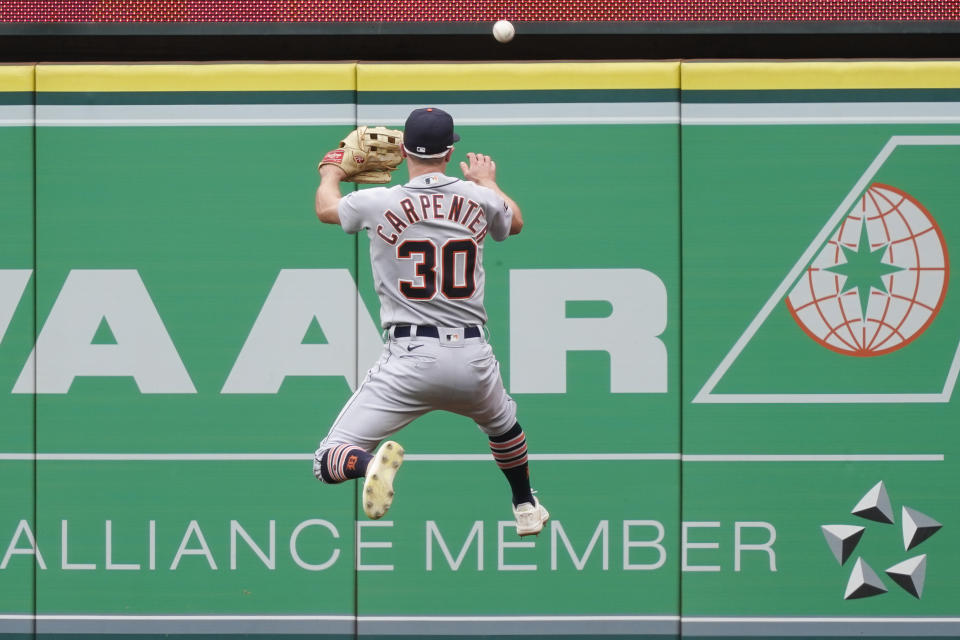 Detroit Tigers right fielder Kerry Carpenter jumps to attempt to catch a double hit by Los Angeles Angels designated hitter Brandon Drury during the fourth inning of a baseball game, Sunday, Sept. 17, 2023, in Anaheim, Calif. (AP Photo/Ryan Sun)