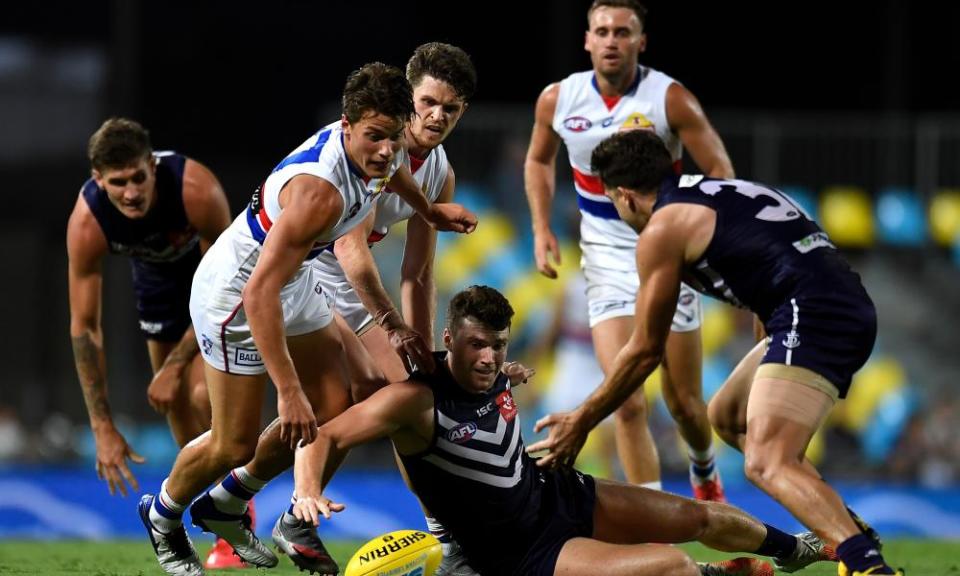 Blake Acres of the Dockers handles the ball