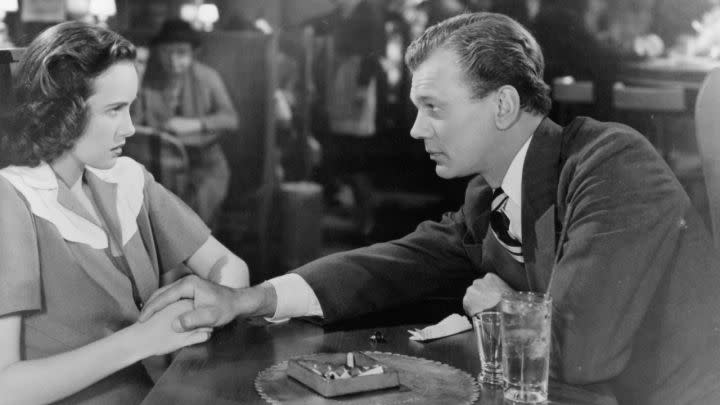 Joseph Cotten as Uncle Charlie talking to a a scared-looking Teresa Wright as Charlie in Shadow of a Doubt,