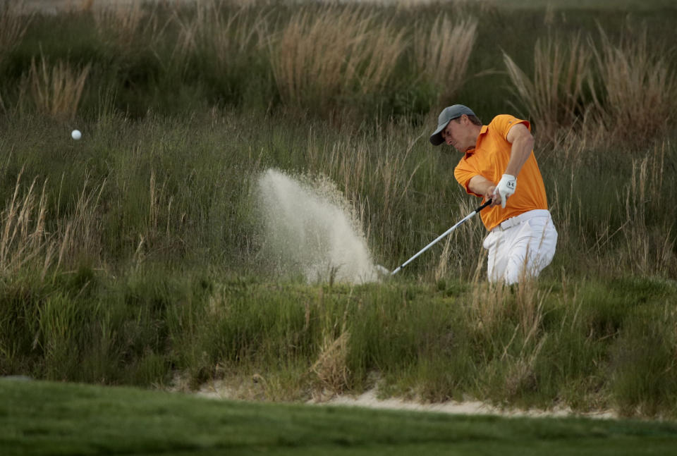 Jordan Spieth hits out of a bunker on the 18th hole during the first round of the PGA Championship golf tournament, Thursday, May 16, 2019, at Bethpage Black in Farmingdale, N.Y. (AP Photo/Andres Kudacki)