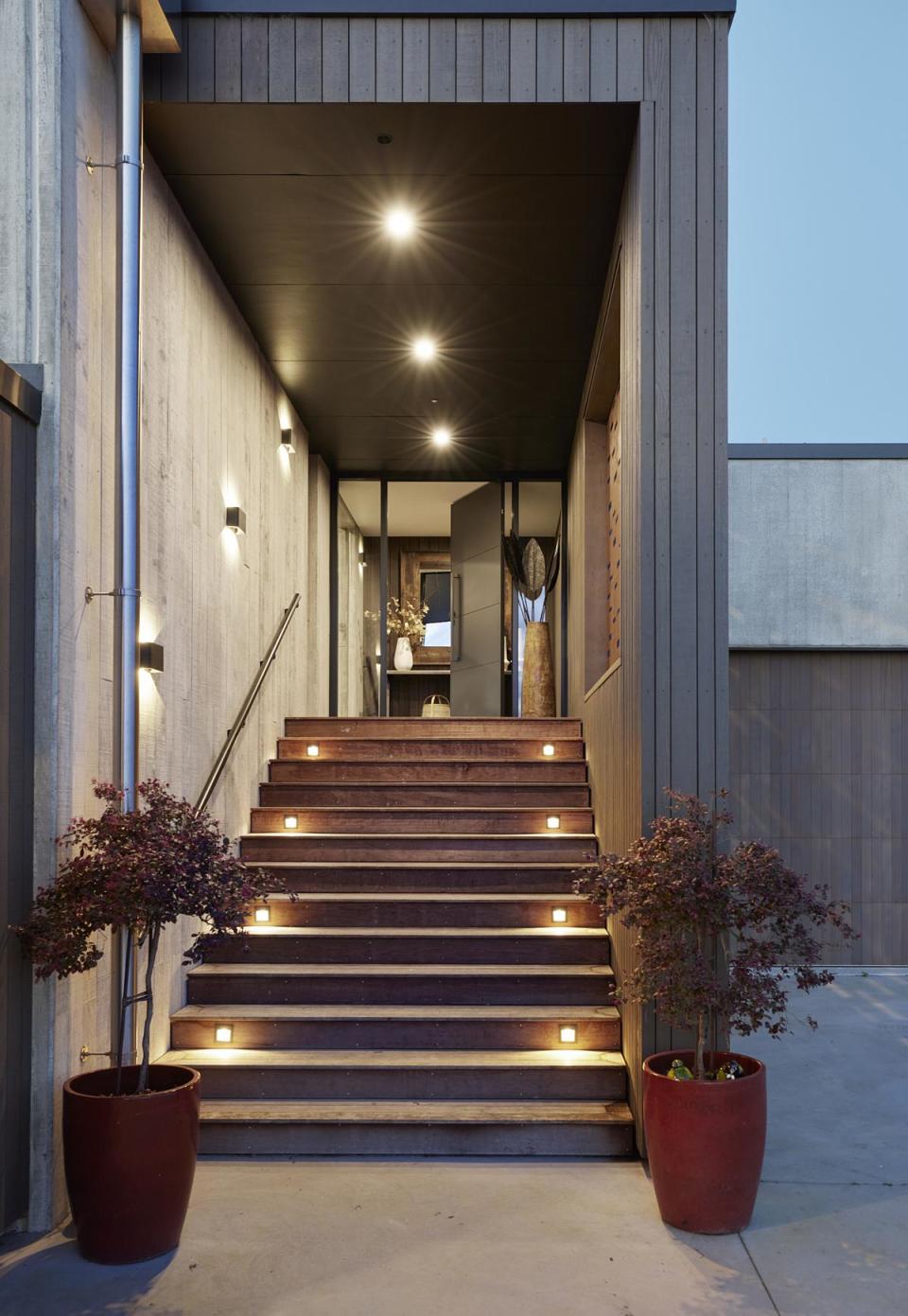 Outdoor lighting up the steps to the front door