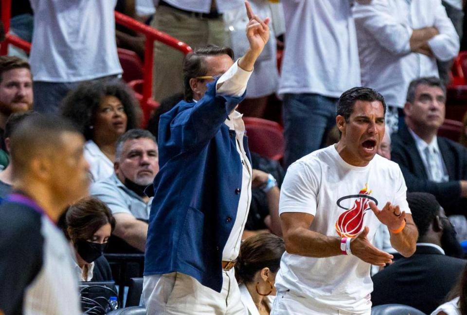 Miami Mayor Francis X. Suarez, right, and technology entrepreneur Sean Wolfington, left, react from courtside during the first quarter of Game 1 of last year’s NBA Eastern Conference Finals series between the Heat and the Boston Celtics at what was then FTX Arena on Tuesday, May 17, 2022.