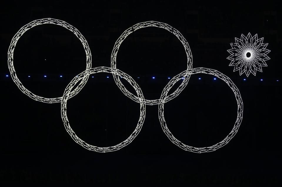 Four out of five Olympic rings are seen lit up during the opening ceremony of the 2014 Sochi Winter Olympics, in this February 7, 2014 file photo. REUTERS/David Gray/Files (RUSSIA - Tags: TPX IMAGES OF THE DAY SPORT OLYMPICS)