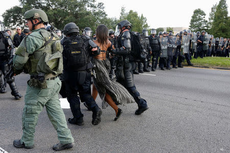 Protestor Ieshia Evans is detained by law enforcement near the headquarters of the Baton Rouge Police Department in Baton Rouge, Louisiana, U.S. July 9, 2016. REUTERS/Jonathan Bachman