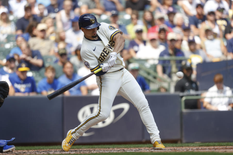 Milwaukee Brewers' Willy Adames drives in a run as he grounds out during the fifth inning of a baseball game against the Kansas City Royals, Wednesday, July 21, 2021, in Milwaukee. (AP Photo/Jeffrey Phelps)
