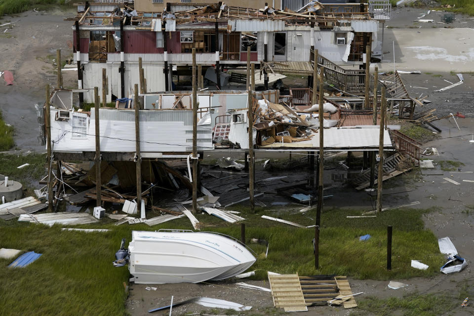 The remains of destroyed homes are seen in the aftermath of Hurricane Ida in Grand Isle, La., Tuesday, Aug. 31, 2021. (AP Photo/Gerald Herbert)