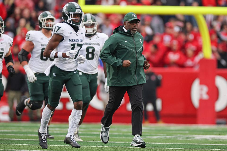 Michigan State Spartans interim head coach Harlon Barnett leads his team onto the field before the game against the Rutgers Scarlet Knights at SHI Stadium on Oct. 14, 2023 in Piscataway, New Jersey.
