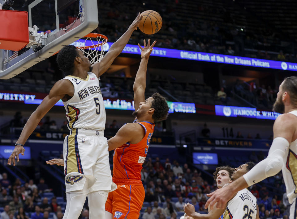 New Orleans Pelicans forward Herbert Jones (5) defends a shot by Oklahoma City Thunder forward Jeremiah Robinson-Earl in the first quarter of an NBA basketball game in New Orleans, Monday, Nov. 28, 2022. (AP Photo/Derick Hingle)