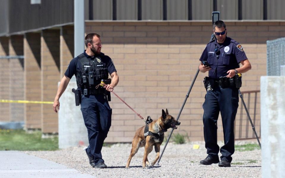 Police patrol the outside of Rigby Middle School following a shooting there - Natalie Behring 