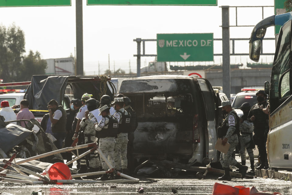 Rescue workers and firefighters work the scene of accident involving multiple vehicles, in Chalco, on the outskirt of Mexico City, Saturday, Nov. 6, 2021. At least 15 people were killed and another five injured in a multiple crash that occurred on a highway in central Mexico on Saturday, firefighters said. (AP Photo)