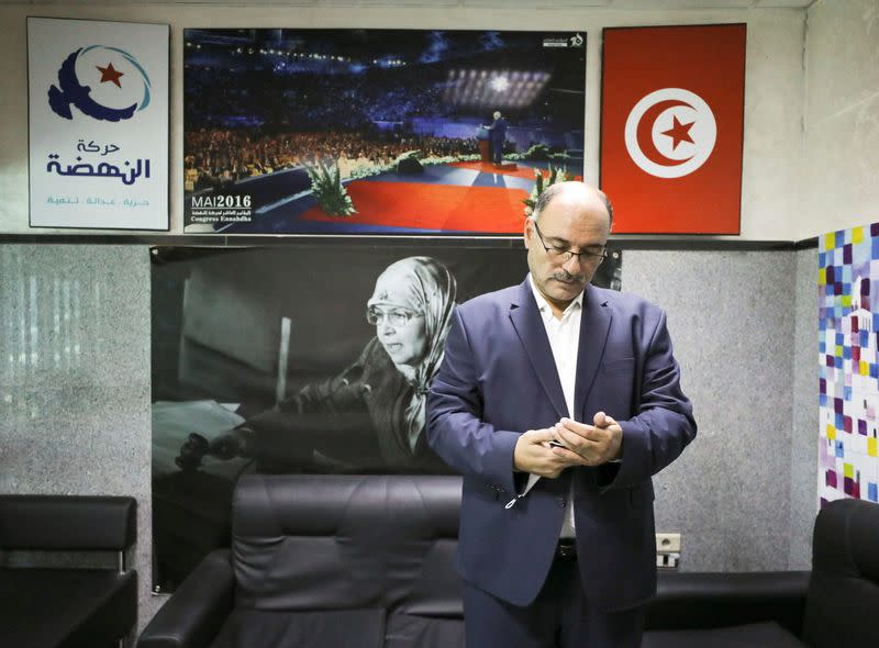 Riadh Chaibi, political advisor of Parliament Speaker Rached Ghannouchi, attends an interview with Reuters at moderate Islamist Ennahda party's headquarters in Tunis