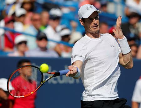 Aug 22, 2015; Cincinnati, OH, USA; Andy Murray (GBR) returns a shot against Roger Federer (not pictured) in the semifinals during the Western and Southern Open tennis tournament at the Linder Family Tennis Center. Aaron Doster-USA TODAY Sports