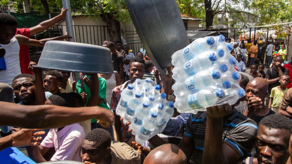 Haitian citizens try to get goods at Liceo Marie Jeanne shelter in Port-au-Prince, Haiti, 21 March 2024. - Mentor David Lorens/EPA-EFE/Shutterstock