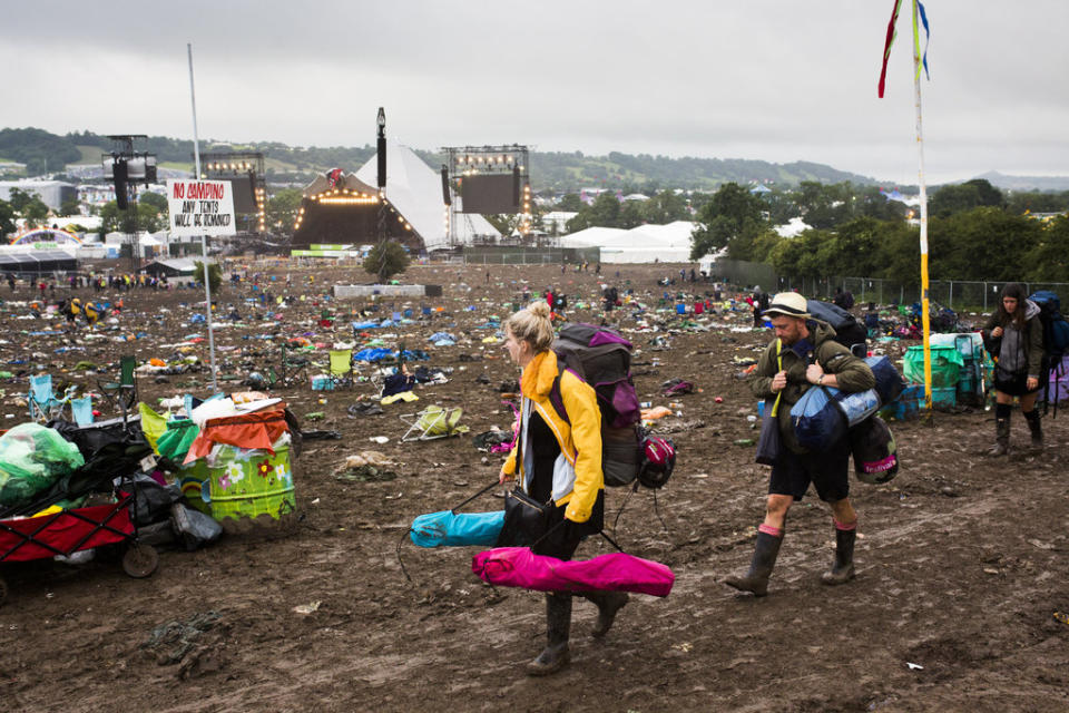 A fan takes a forlorn last look at Glastonbury before leaving.
