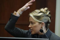 Actor Amber Heard testifies in the courtroom at the Fairfax County Circuit Courthouse in Fairfax, Va., Monday, May 16, 2022. Actor Johnny Depp sued his ex-wife Amber Heard for libel in Fairfax County Circuit Court after she wrote an op-ed piece in The Washington Post in 2018 referring to herself as a "public figure representing domestic abuse." (AP Photo/Steve Helber, Pool)