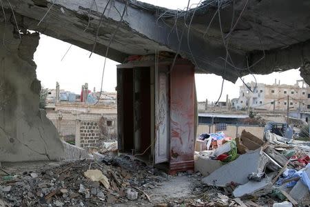 A damaged house is seen after an airstrike in the rebel-held southern town of Bosra al-Sham, Deraa Governorate, Syria February 17, 2017. REUTERS/Alaa Al-Faqir