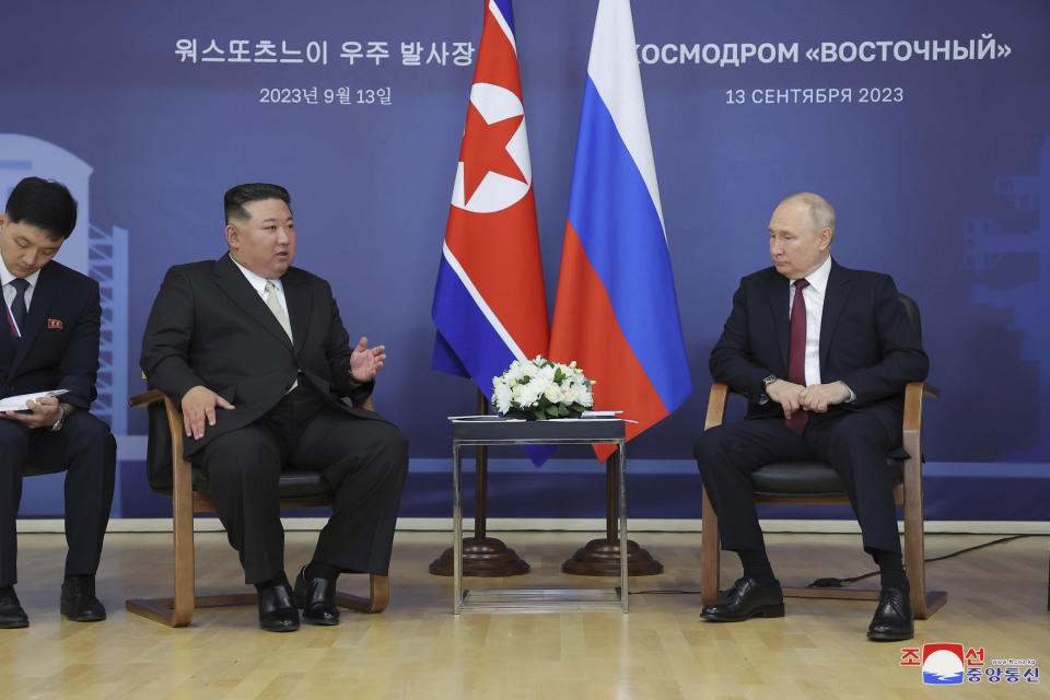 In this photo provided by the North Korean government, North Korean leader Kim Jong Un, left, and Russian President Vladimir Putin talk at the Vostochny cosmodrome outside the city of Tsiolkovsky, about 200 kilometers (125 miles) from the city of Blagoveshchensk in the far eastern Amur region, Russia, Wednesday, Sept. 13, 2023. Independent journalists were not given access to cover the event depicted in this image distributed by the North Korean government. The content of this image is as provided and cannot be independently verified. Korean language watermark on image as provided by source reads: "KCNA" which is the abbreviation for Korean Central News Agency. (Korean Central News Agency/Korea News Service via AP)