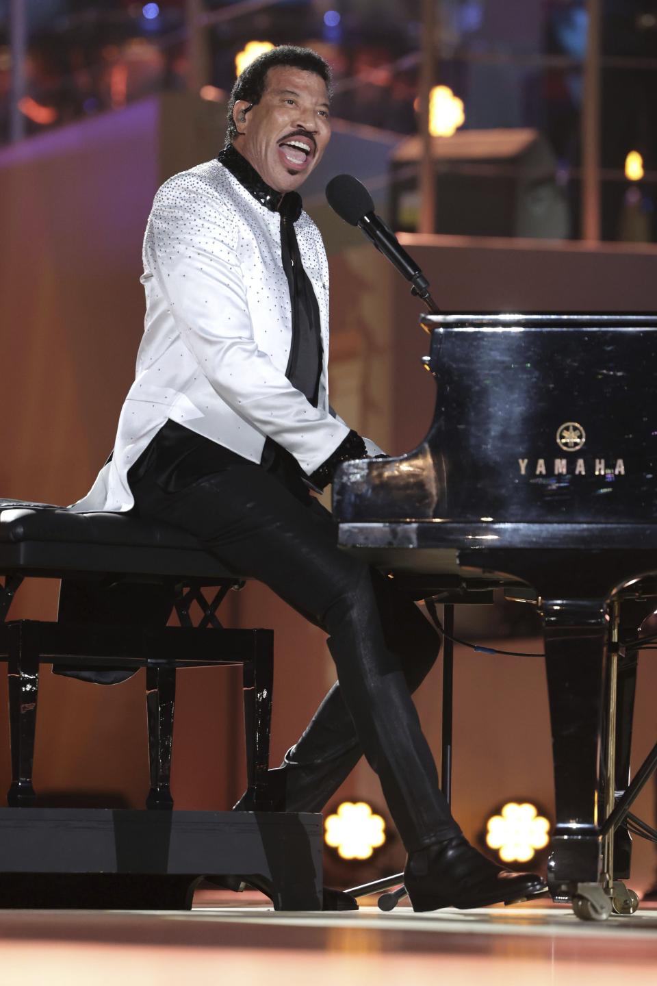 US singer Lionel Richie performs during a concert at Windsor Castle in Windsor, England, Sunday, May 7, 2023, celebrating the coronation of King Charles III. It's one of several events over a three-day weekend of celebrations. (Chris Jackson/Pool Photo via AP)