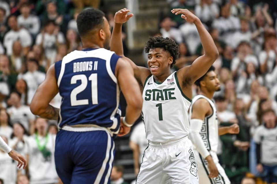 Michigan State's Jeremy Fears Jr. celebrates after Jaden Akins' 3-pointer against Butler during the first half on Friday, Nov. 17, 2023, in East Lansing.