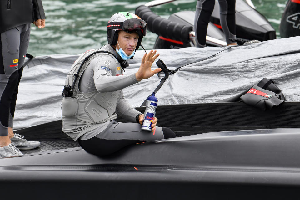 FILE - In this March 10, 2021, file photo, Italy's Luna Rossa helmsman Jimmy Spithill waves as he prepares to race Team New Zealand in race one of the America's Cup on Auckland's Waitemata Harbour. Two-time America’s Cup champion Jimmy Spithill is in his first season as skipper and CEO of the U.S. SailGP team, which on Thursday, June 3, 2021, launched Foiling First, a development program designed to be the first professional pathway to foiling in the United States and a catalyst for meaningful change in sailing. (Alan Lee/Photosport via AP, File)