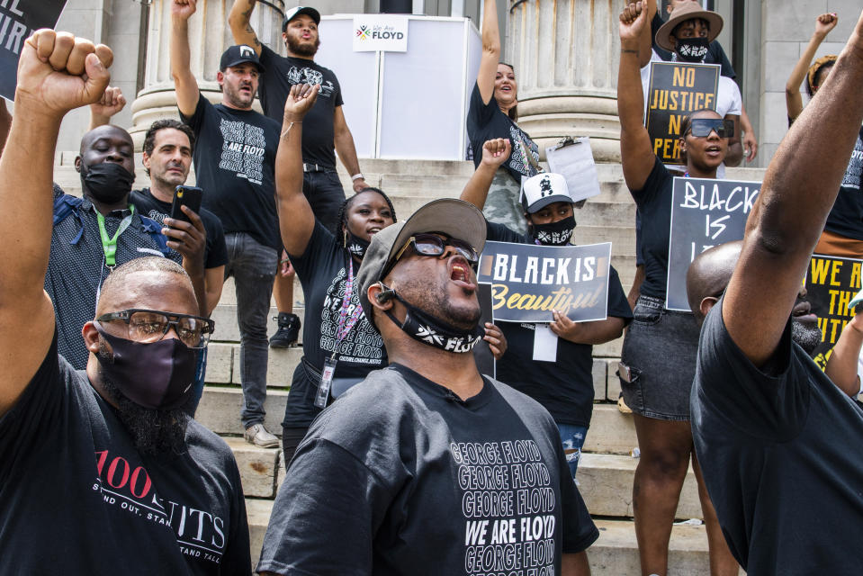 Terrence Floyd, center, the brother of George Floyd, attends a rally on Sunday, May 23, 2021, in Brooklyn borough of New York. George Floyd, whose May 25, 2020 death in Minneapolis was captured on video, plead for air as he was pinned under the knee of former officer Derek Chauvin, who was convicted of murder and manslaughter in April 2021. (AP Photo/Eduardo Munoz Alvarez)