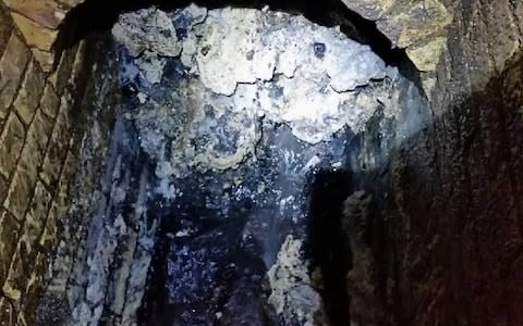 A photograph of the so-called Whitechapel fatberg - a buildup weighing more than 10 double-decker buses blocking a sewer in east London - Credit: Thames Water/PA