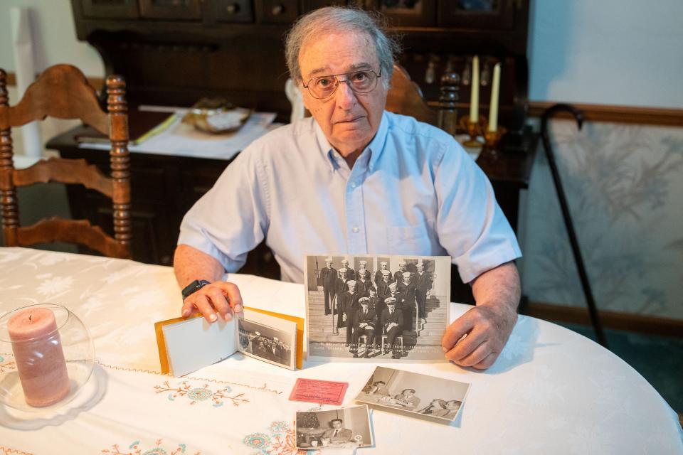 Sal Martocci reminisces on his time serving during the Korean War while looking at old photographs Wednesday, April 10, 2024.