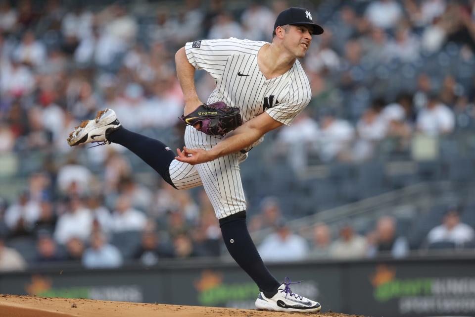 May 8, 2024; Bronx, New York, USA; New York Yankees starting pitcher Carlos Rodon (55) follows through on a pitch against the Houston Astros during the first inning at Yankee Stadium. Mandatory Credit: Brad Penner-USA TODAY Sports