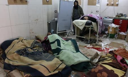 Injured people wait inside a hospital to be evacuated from a rebel-held sector of eastern Aleppo, Syria December 17, 2016. REUTERS/Abdalrhman Ismail