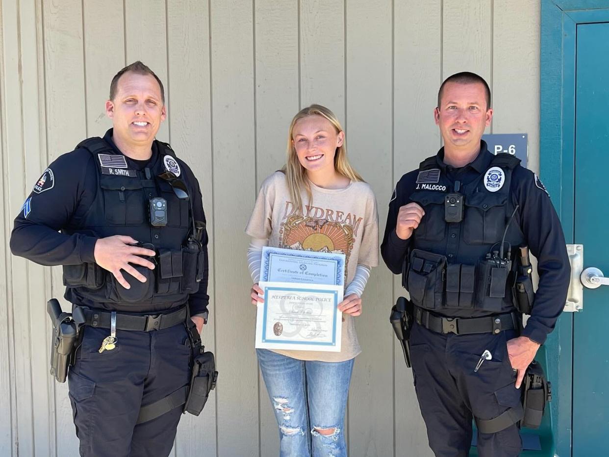 Sultana High School senior Sarah Chatten is flanked by Hesperia Unified School District Police Department Cpl. Smith, left, and Officer Malocco. Chatten recently completed an internship with the department.