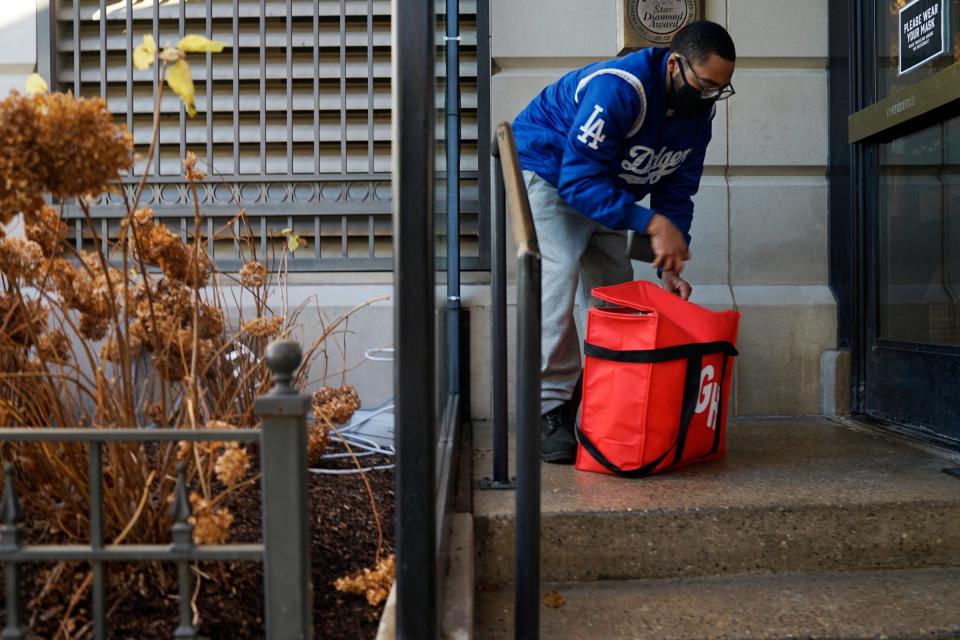 Scammers craft elaborate schemes for food delivery scams. Grubhub recommends that diners monitor their account. use a password that is unique to Grubhub and change the password regularly. File photo: Kevin Hayes, a delivery employee for Grubhub, picks up an order Dec. 2, 2020, in Birmingham.