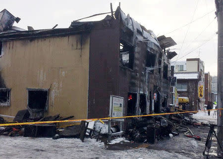 The charred exterior of a senior persons welfare facility is pictured in Sapporo, Hokkaido, Japan Februray 1, 2018, in this picture obtained from social media. @COMINVOICE/via REUTERS