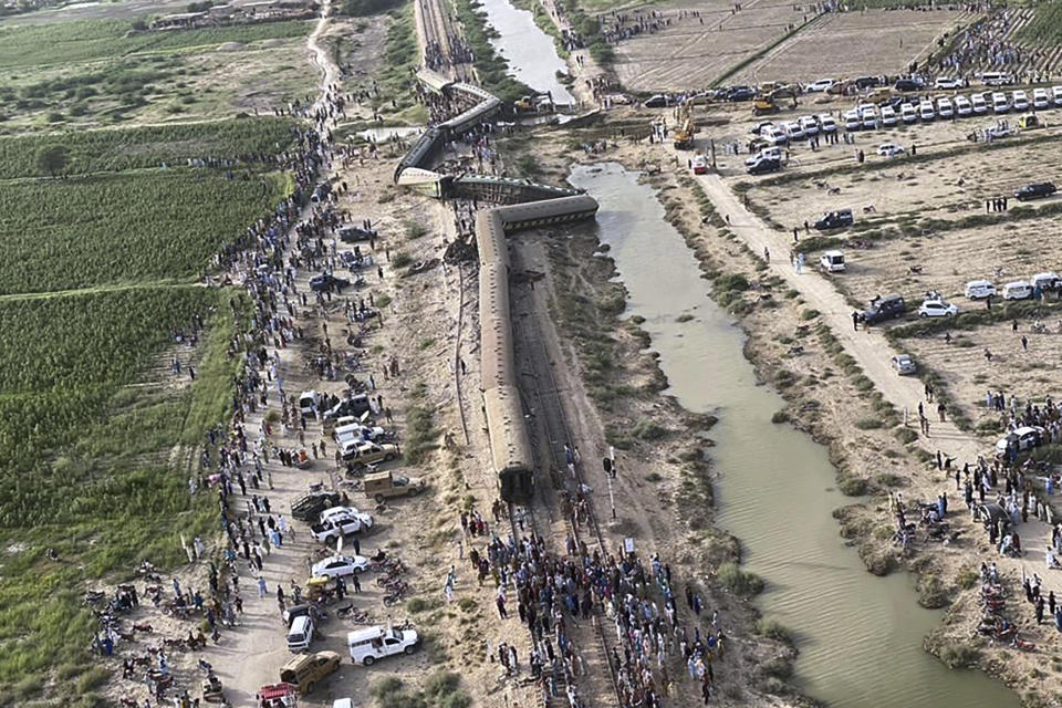 In this photo released by Chief Minister office of Pakistani Sindh province, shows an arial view of the site of a passenger train derailed near Nawabshah, Pakistan, Sunday, Aug. 6, 2023. Railway officials say some passengers were killed and dozens more injured when a train derailed near the town of Nawabshah in southern Sindh province. (Sindh Chief Minister office via AP)