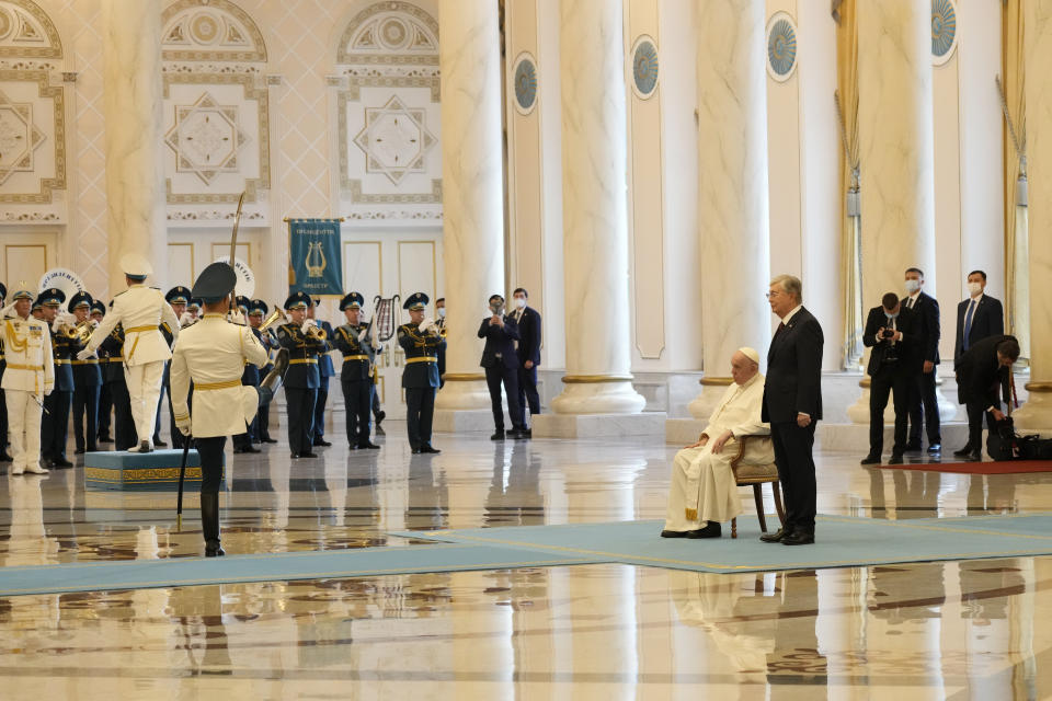 Pope Francis attends with Kazakhstan's President Kassym-Jomart Tokayev the welcome ceremony at the Presidential Palace Ak Orda, in Nur-Sultan, Kazakhstan, Tuesday, Sept. 13, 2022. Pope Francis begins a 3-days visit to the majority-Muslim former Soviet republic to minister to its tiny Catholic community and participate in a Kazakh-sponsored conference of world religious leaders. (AP Photo/Andrew Medichini)