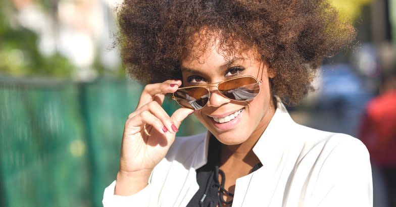 African American woman wearing aviator sunglasses