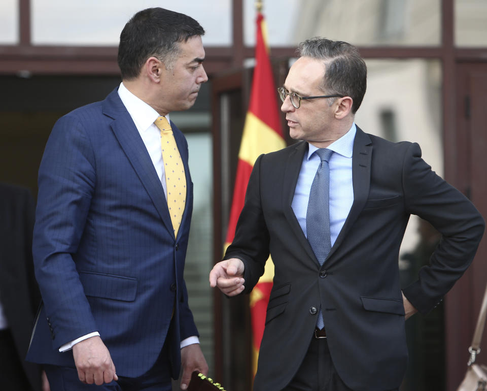 German Foreign Minister Heiko Maas, right, talks with his North Macedonia's counterpart Nikola Dimitrov, after their meeting in Skopje, North Macedonia, on Wednesday, Nov. 13, 2019. Maas arrived Wednesday in Skopje to discuss with his counterpart Nikola Dimitrov the bilateral relations and the further steps after North Macedonia has failed to open the membership talks with European Union last month. (AP Photo/Boris Grdanoski)