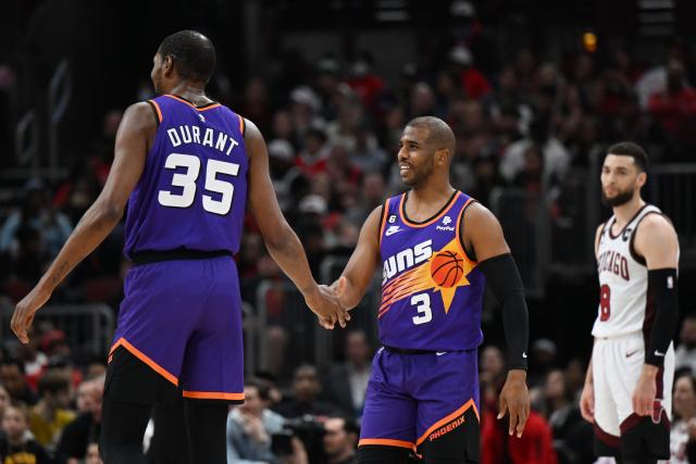 CHICAGO, ILLINOIS - MARCH 03: Chris Paul #3 and Kevin Durant #35 of the Phoenix Suns celebrate in front of Zach LaVine #8 of the Chicago Bulls in the first half at United Center on March 03, 2023 in Chicago, Illinois.  NOTE TO USER: User expressly acknowledges and agrees that, by downloading and or using this photograph, User is consenting to the terms and conditions of the Getty Images License Agreement.  (Photo by Quinn Harris/Getty Images)