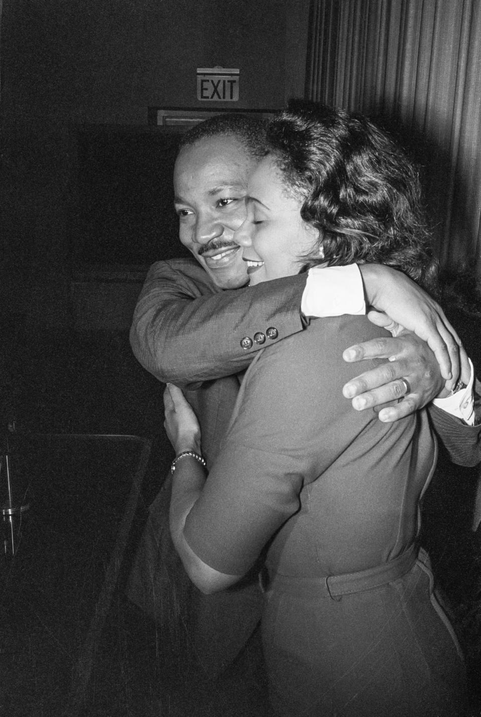 Dr. Martin Luther King, Jr. hugs his wife Coretta during a news conference following the announcement that he had been awarded the Nobel Peace Prize on 	Oct. 14, 1964. (Bettmann Archive)