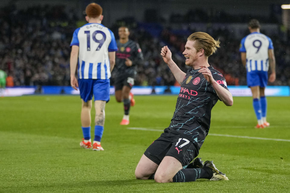 Manchester City's Kevin De Bruyne celebrates after scoring his side's opening goal during the English Premier League soccer match between Brighton and Manchester City at the Falmer Stadium in Brighton, England, Thursday, April 25, 2024. (AP Photo/Kin Cheung)