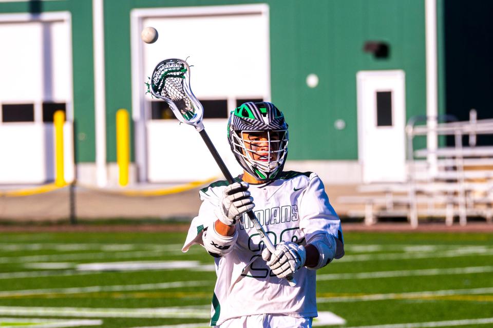 Dartmouth's Jackson Hart moves the ball around the field.