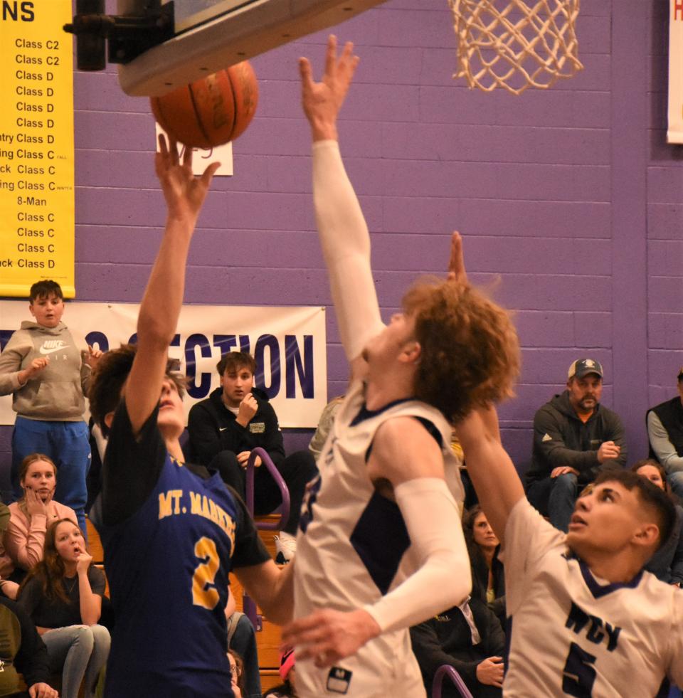 Caden Walker (2) puts up the final shot of the game for Mt. Markham Wednesday at West Canada Valley's ninth annual Christmas basketball tournament. Walker's shot missed, Ryan Roberts (5) grabbed the rebound, and West Canada Valley held on for a one-point win in overtime.