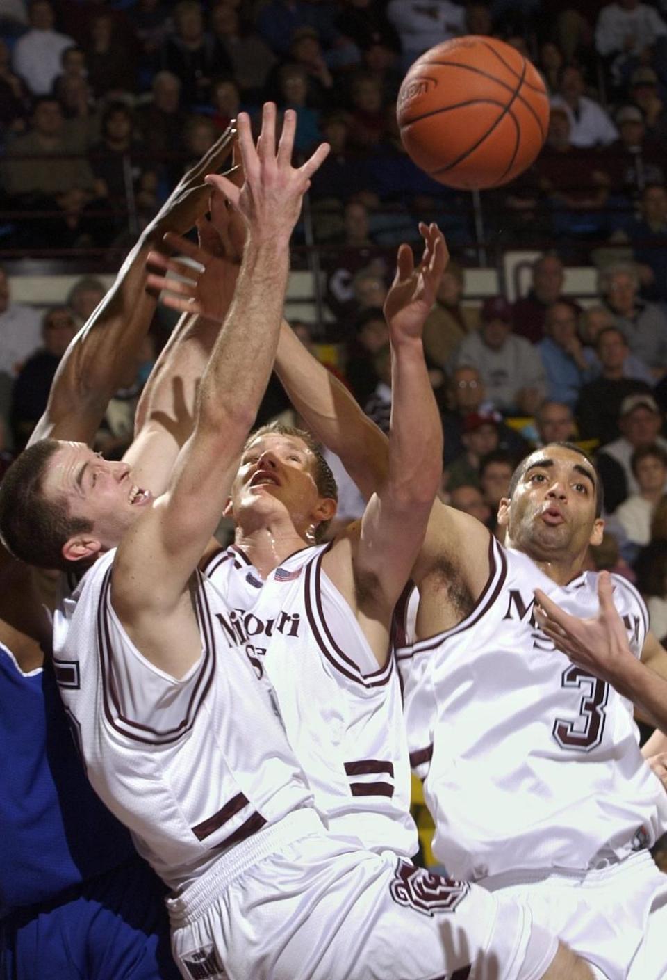 From left, Missouri State's Blake Ahearn, Nathan Bilyeu and Tyler Chaney battle for a rebound against Indiana State Friday night at Hammons Student Center.