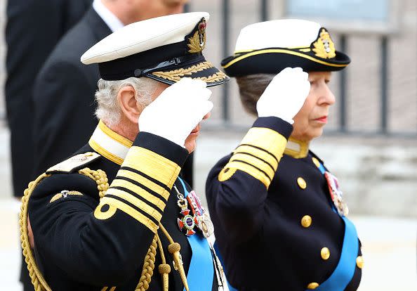 LONDON, ENGLAND - SEPTEMBER 19: King Charles III, and Princess Anne, Princess Royal salute as they take part in the state funeral and burial of Queen Elizabeth II at Westminster Abbey on September 19, 2022 in London, England. Members of the public are able to pay respects to Her Majesty Queen Elizabeth II for 23 hours a day from 17:00 on September 18, 2022 until 06:30 on September 19, 2022. Queen Elizabeth II died at Balmoral Castle in Scotland on September 8, 2022, and is succeeded by her eldest son, King Charles III. (Photo by Hannah McKay- WPA Pool/Getty Images)