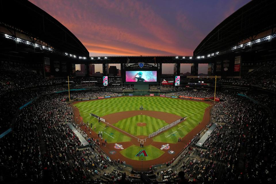 The sun sets as Diamondbacks players are introduced during Opening Day 2024 at Chase Field.