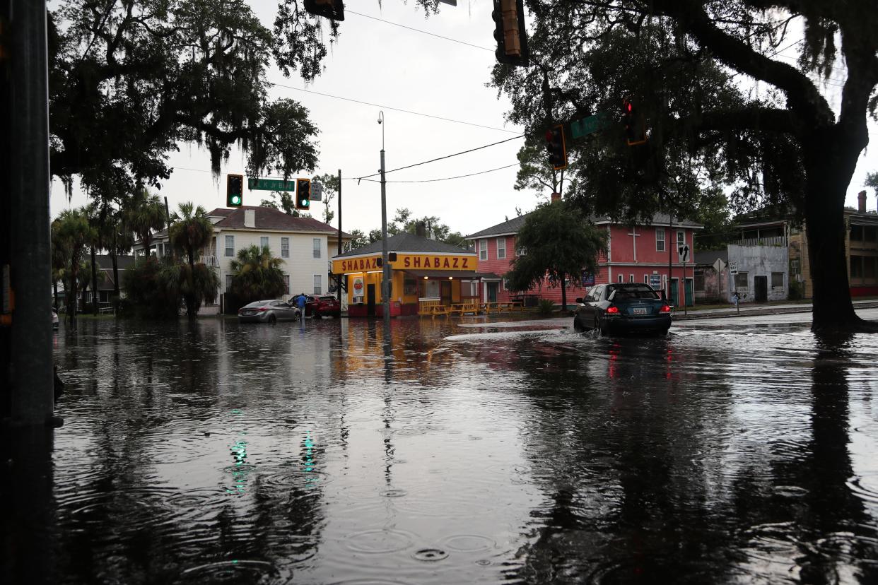 Cars are abandoned after heavy rains caused the intersection of Victory Drive and MLK Jr Boulevard to flood on Monday, July 22, 2024.