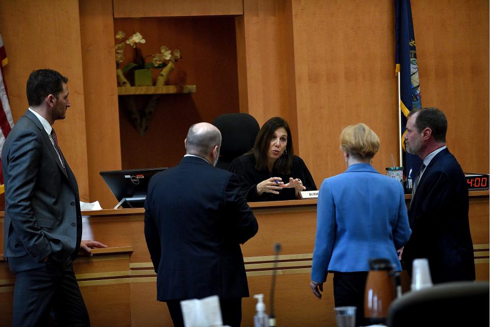 Superior Court Justice Amy Messer conducts a bench meeting with lawyers at jury selection for the Adam Montgomery murder trial at Hillsborough County Superior Court in Manchester, N.H, on Feb. 6, 2024. He is accused of killing his five-year-old daughter, Harmony. From left are Assistant New Hampshire Attorney Generals Christopher Knowles and Benjamin Agati and Public Defenders Caroline Smith and James Brooks. David Lane/UNION LEADER POOL