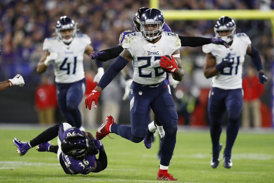 Tennessee Titans running back Derrick Henry (22) runs past Baltimore Ravens strong safety Chuck Clark (36) during the second half of an NFL divisional playoff football game, Saturday, Jan. 11, 2020, in Baltimore. (AP Photo/Julio Cortez)